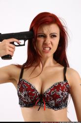 Nina Sitting Pose With Pistol Pose 